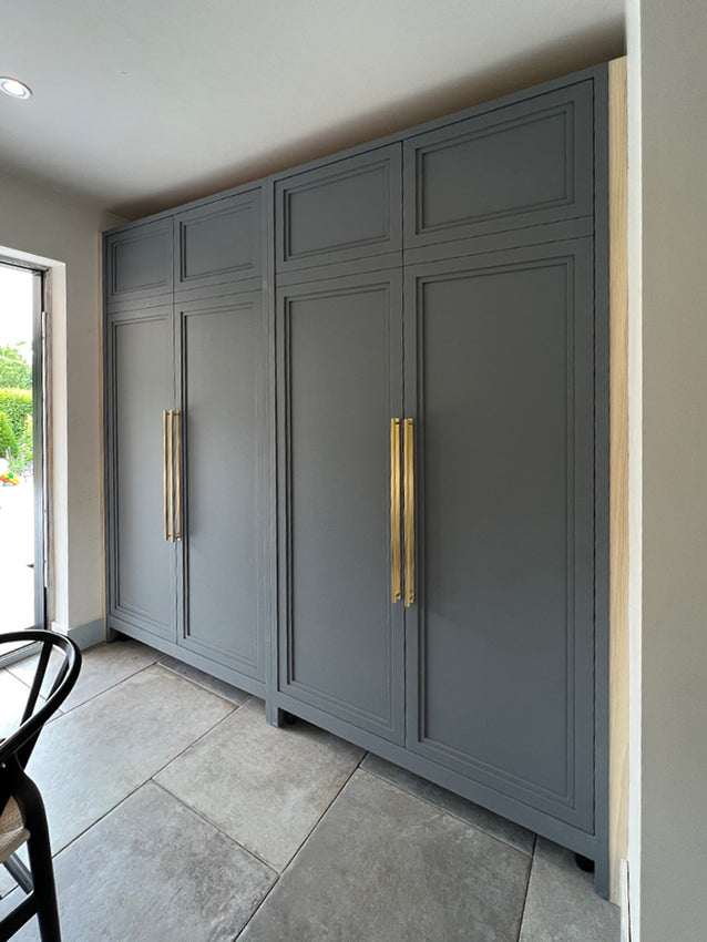 Hove - kitchen larder units, with contemporary multi-layered design, being installed.