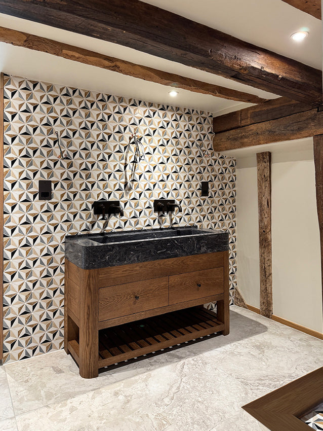 Maidstone - bespoke double vanity unit with curved solid oak legs and curved Corian trough basin. Set against Artisans of Devizes marble tiles and original beams