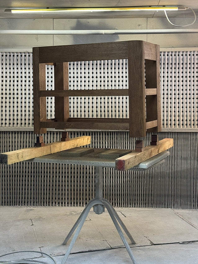 Workshop - curved oak vanity units being spray-stained and finished with a water-proofing lacquer